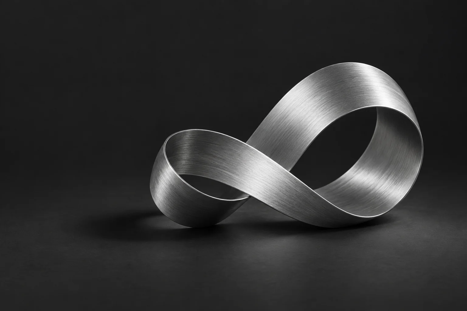 Concept artwork of a sculptural brushed-metal loop in a charcoal studio